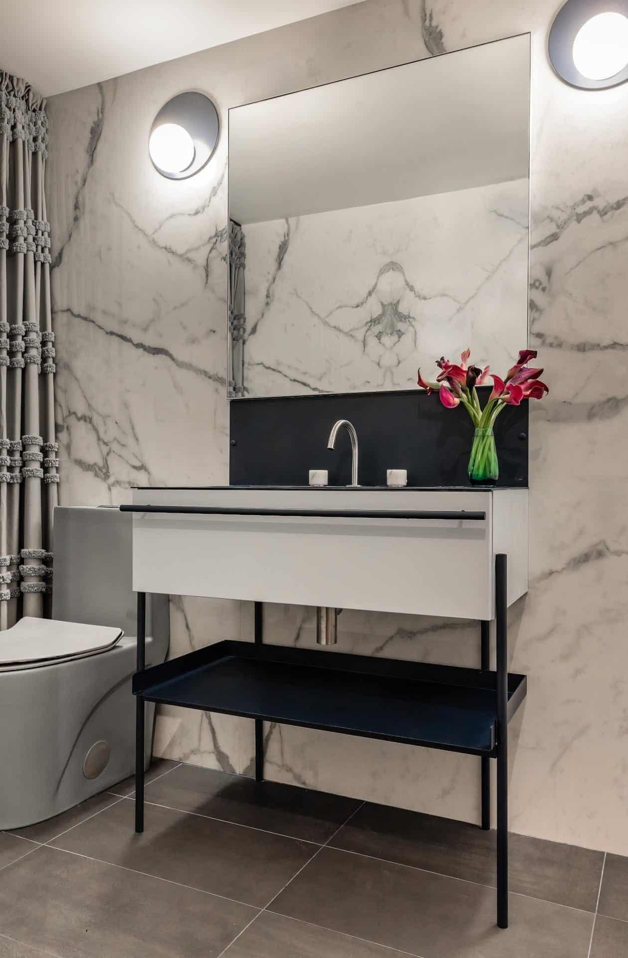 White basin with two taps on the vanity