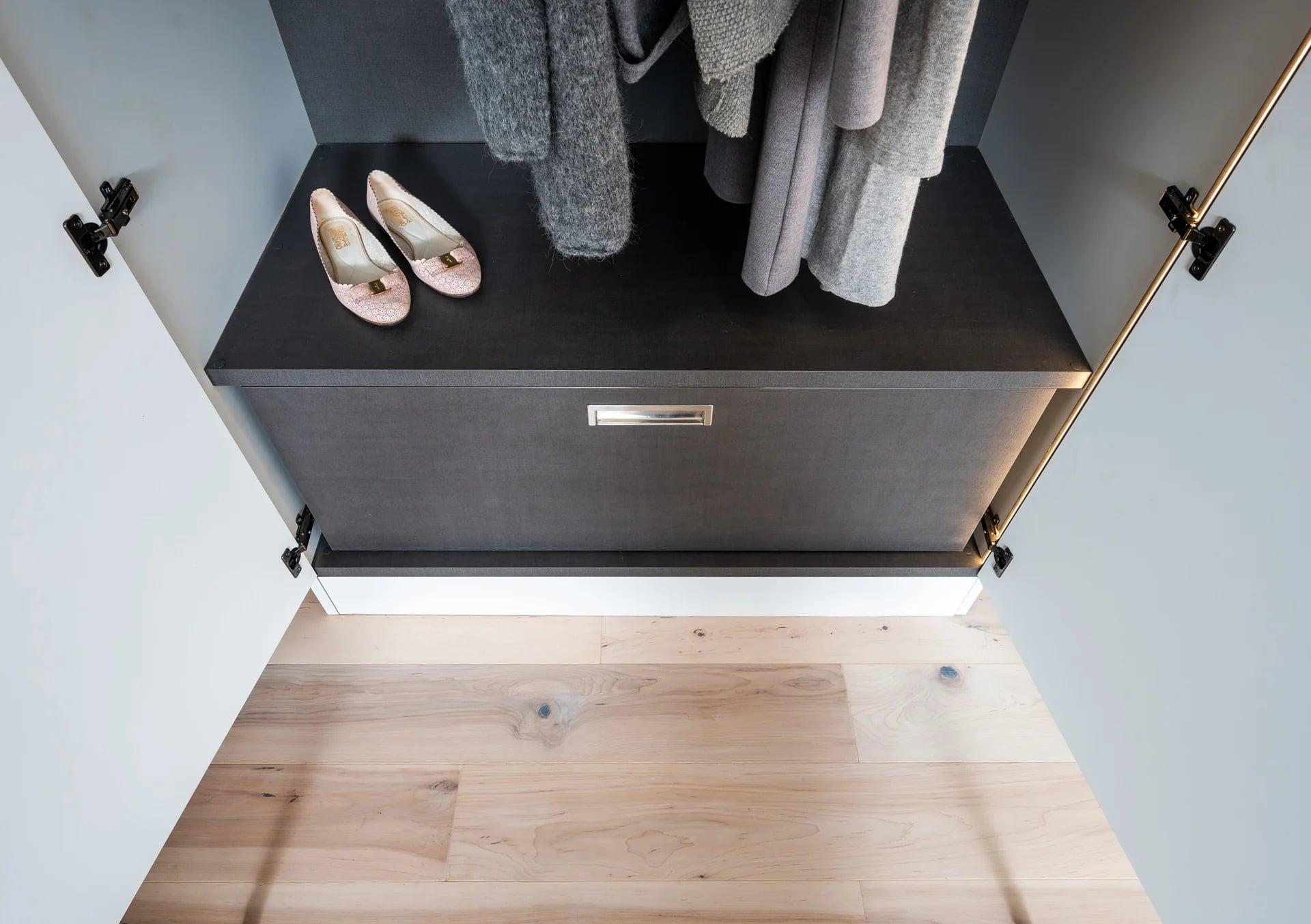 Wardrobe open onto shelves and hanging space