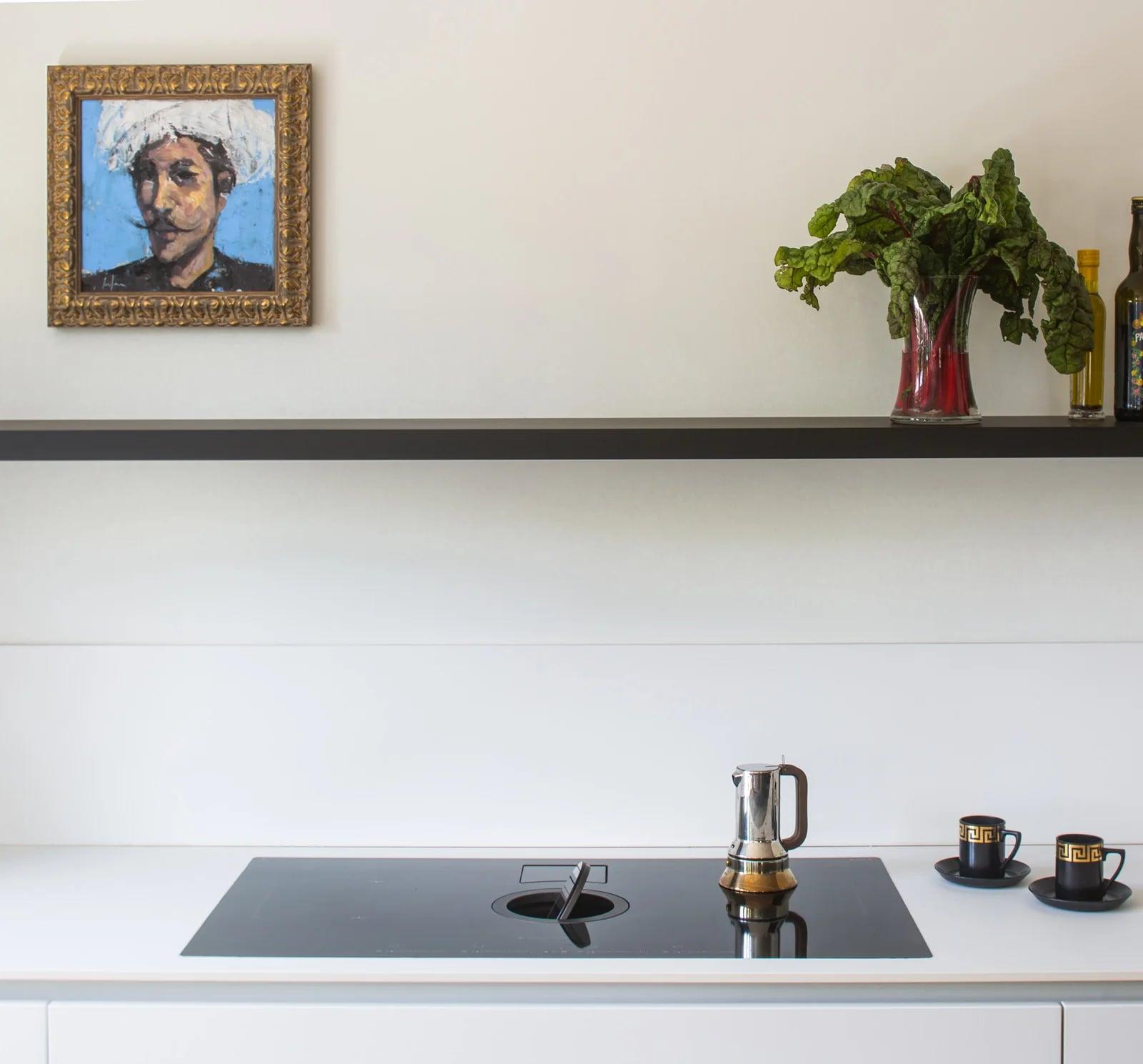 Close-up of the sink and tap set into the Fenix worktop
