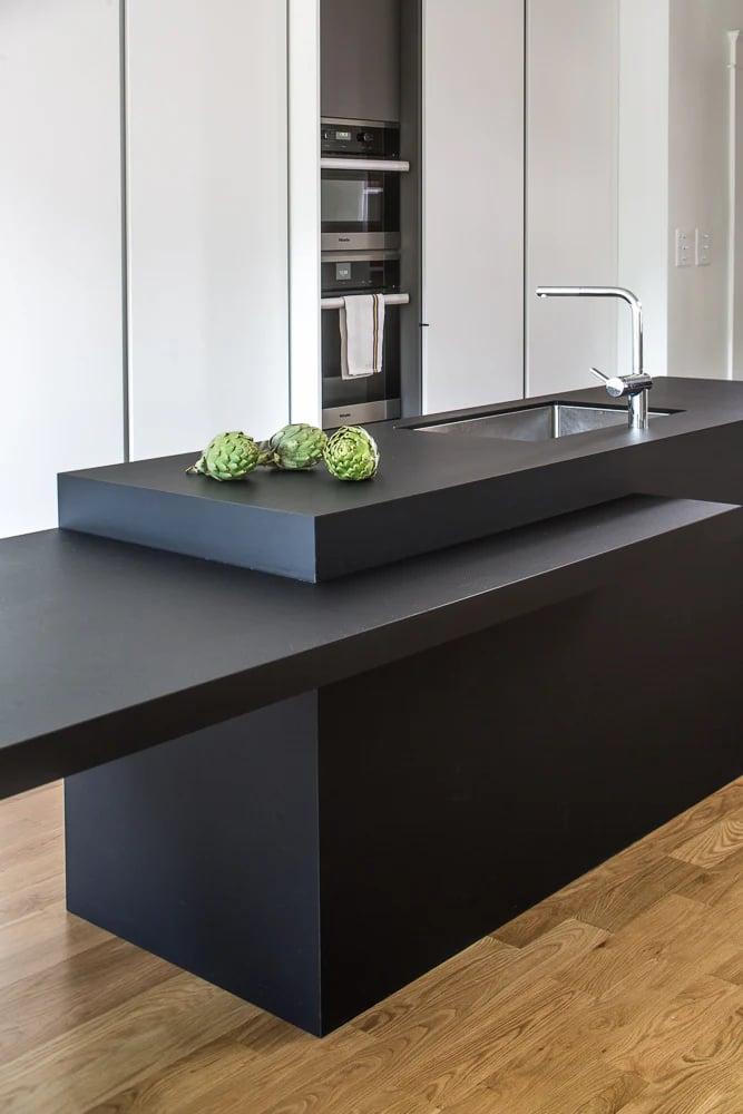 Gas hob and glassware on the white worktop