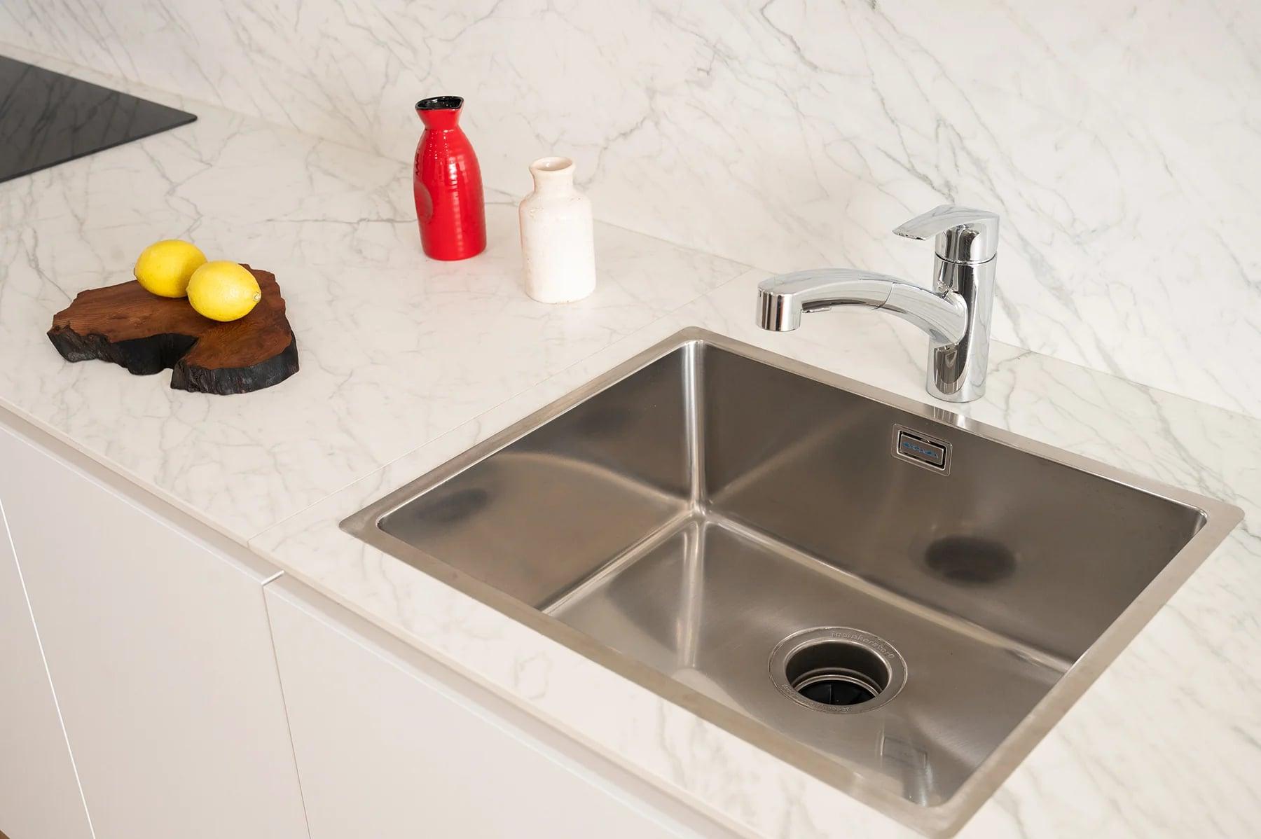 Kitchen run with a pantry and a stainless-steel sink