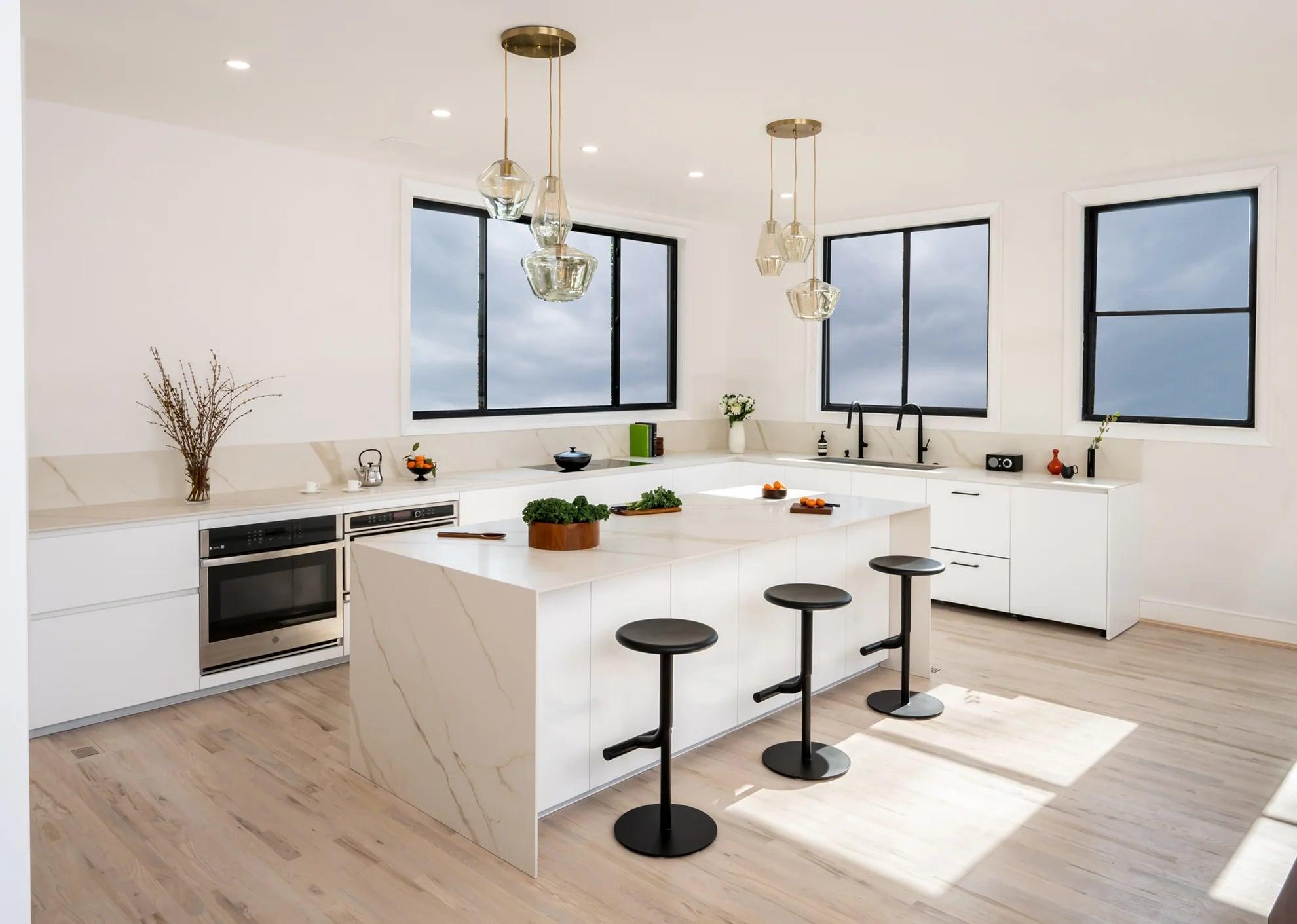White units and black island seen from the living room