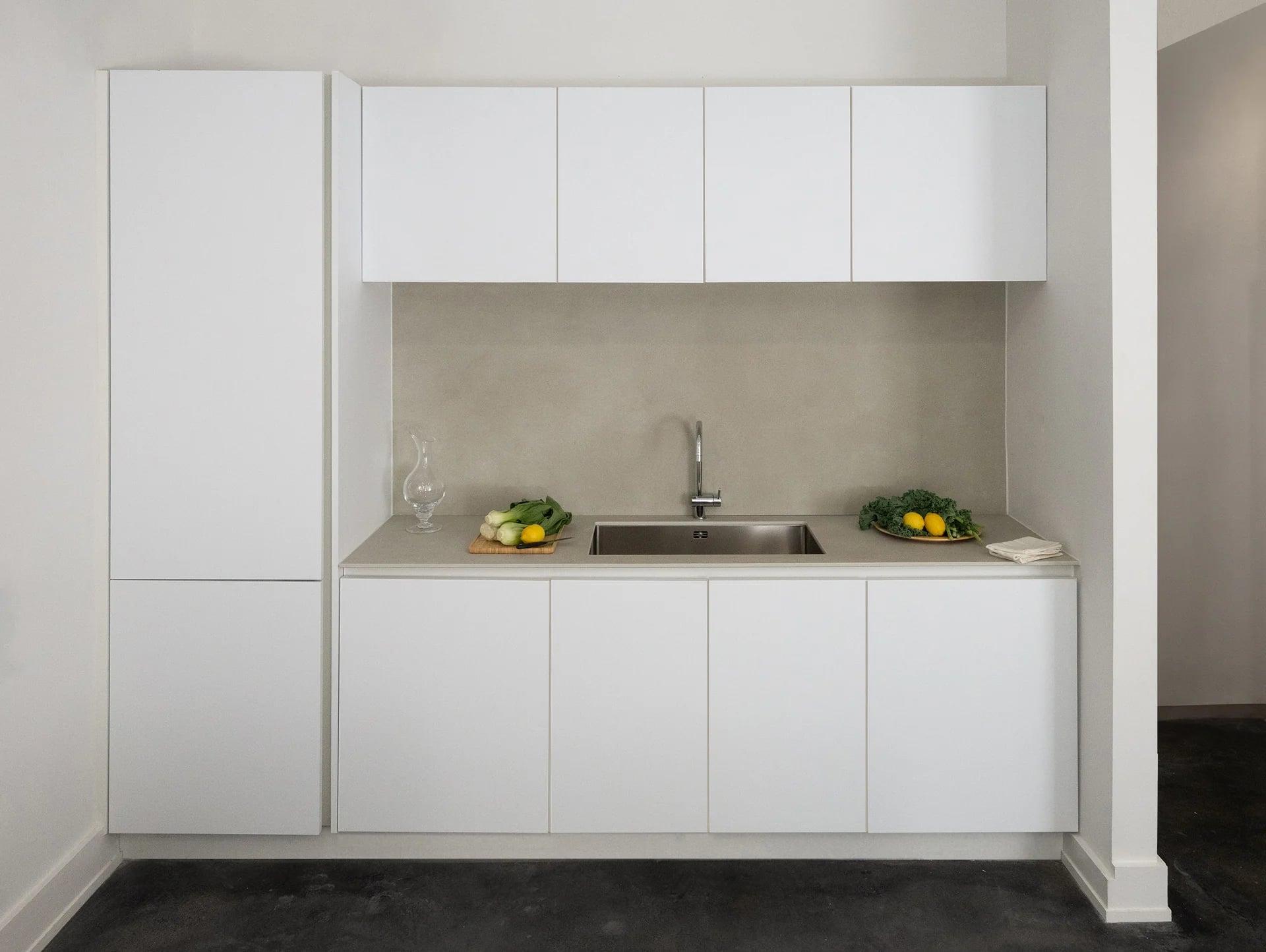 Wood and white kitchen with a small breakfast table