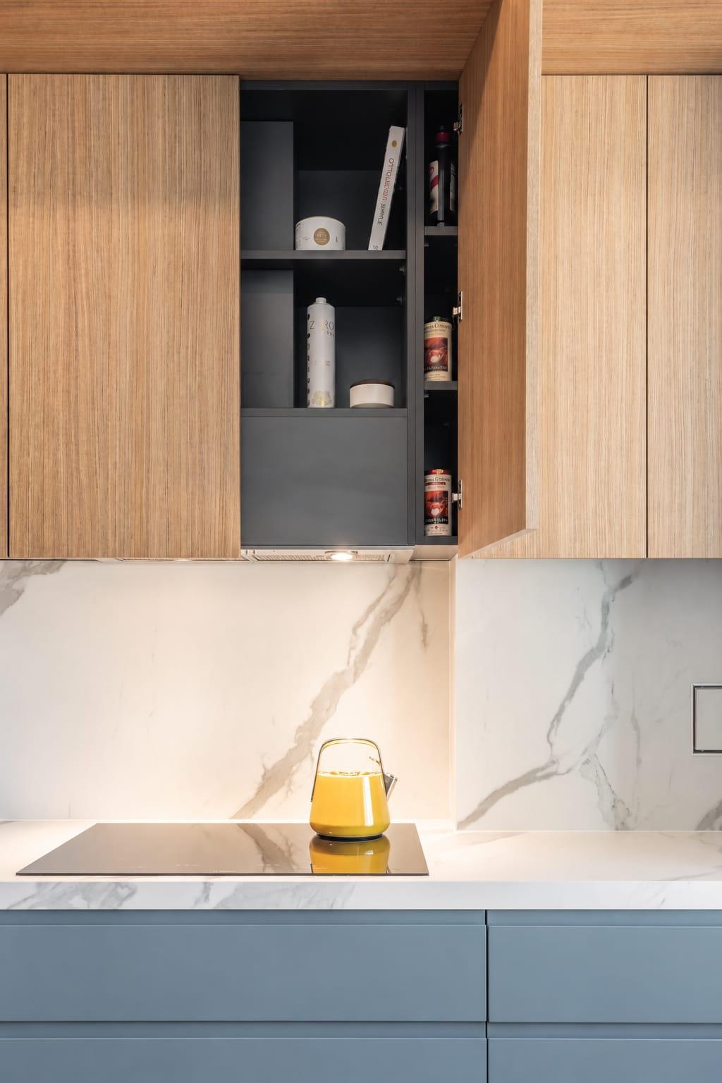 Oak wall cabinet with an open niche over a marble splashback