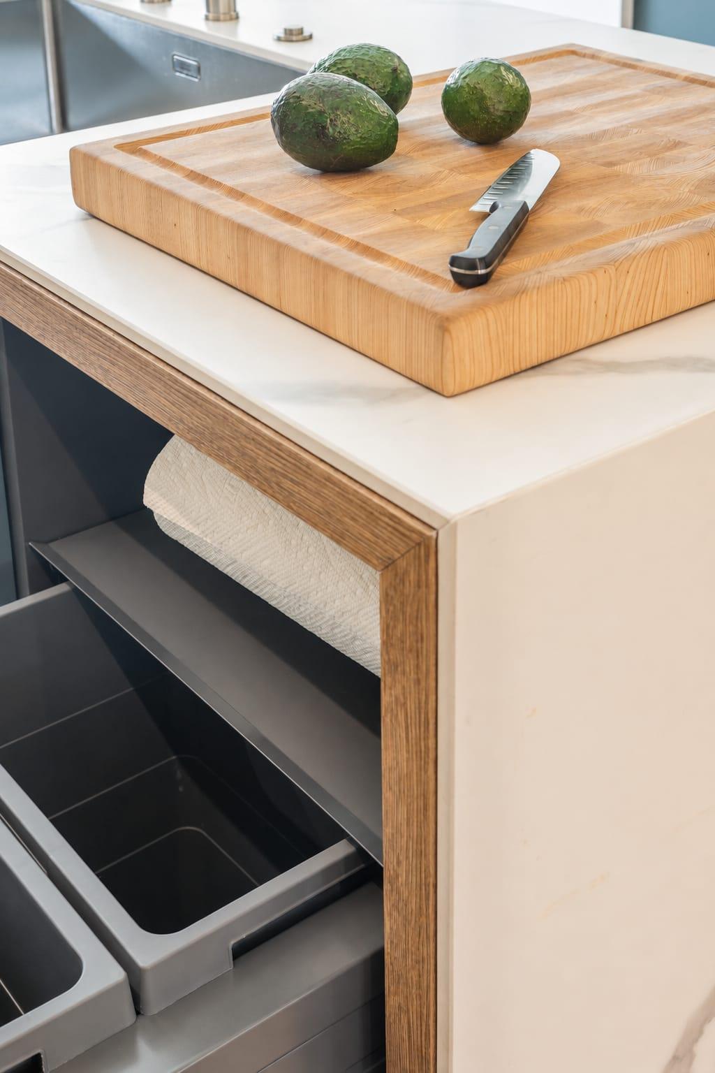 Bin drawer under a marble worktop with a chopping board