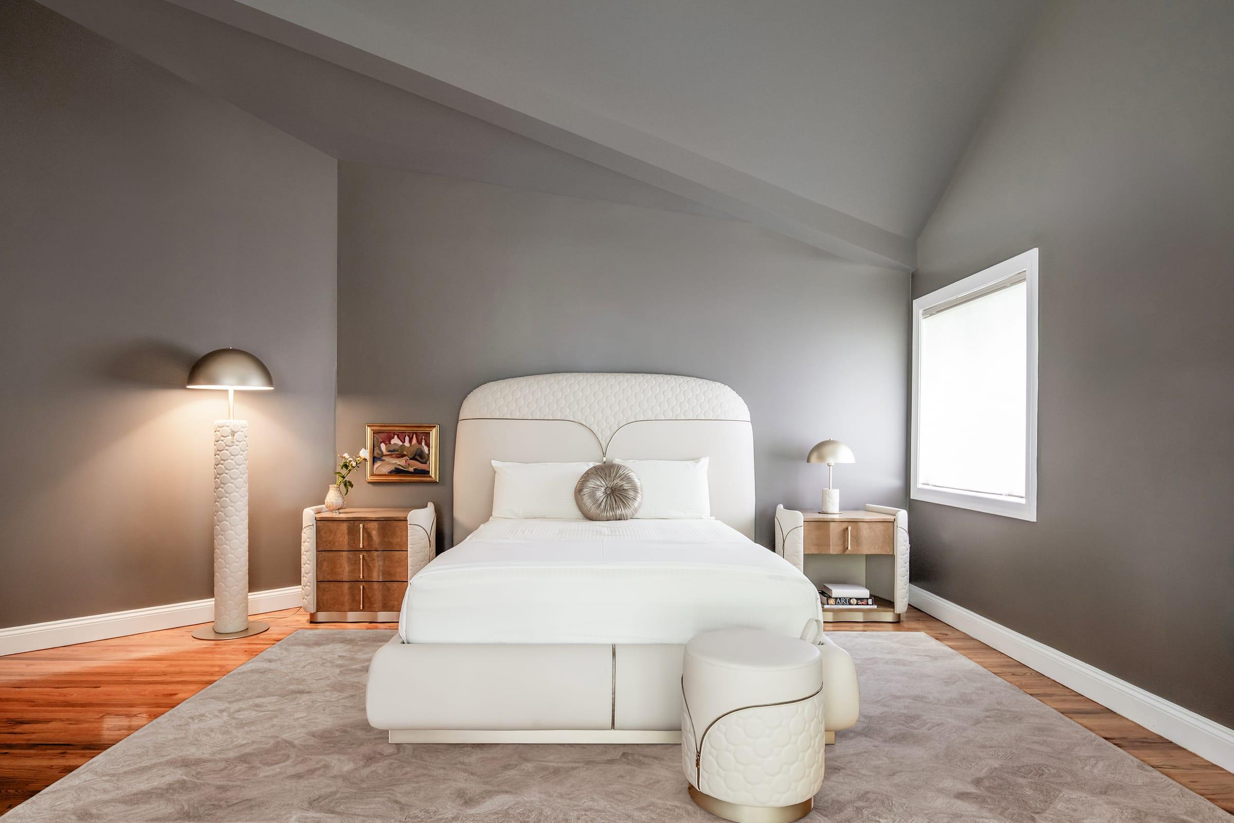 Bedroom with an upholstered bed and two bedside tables