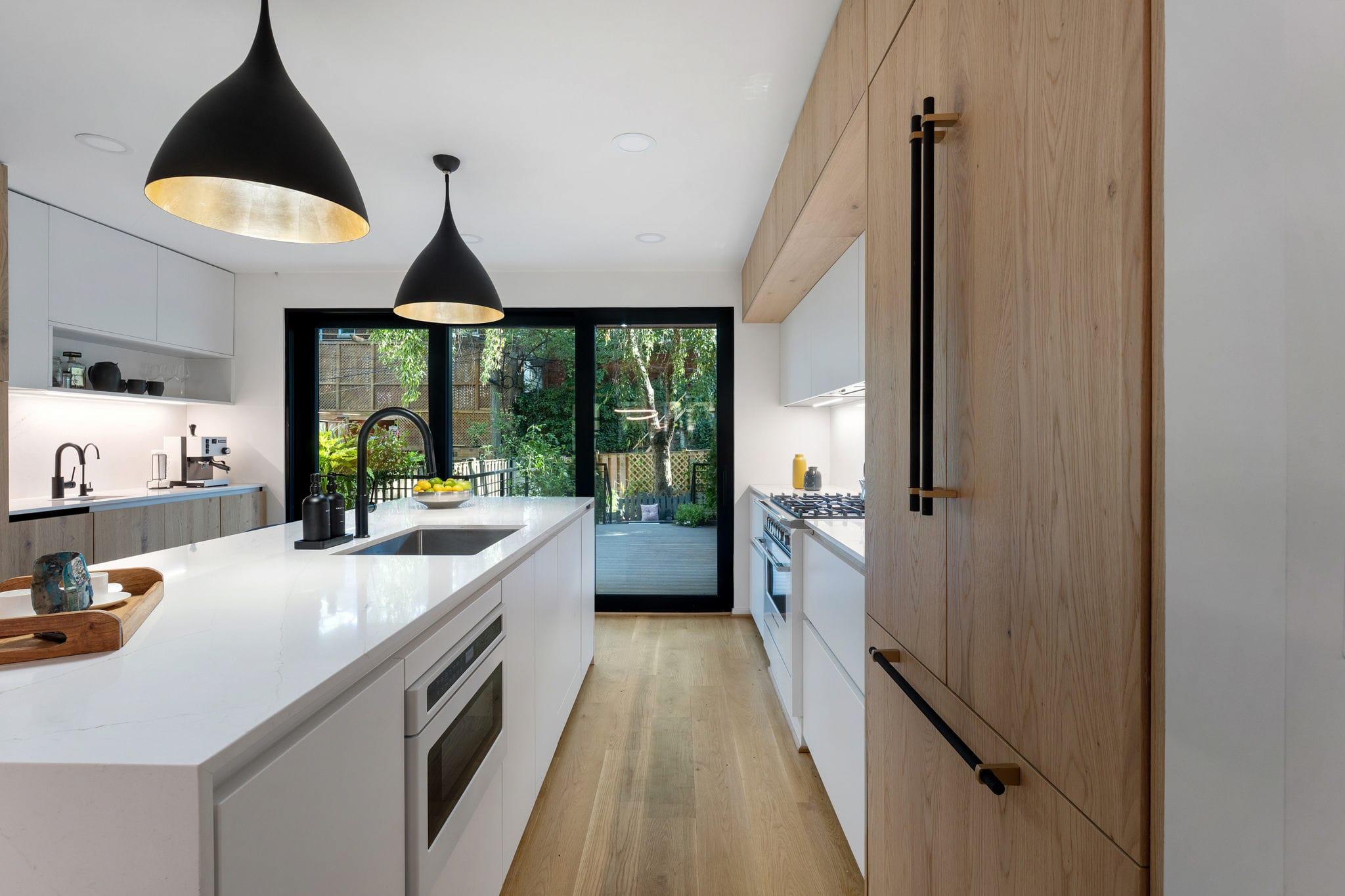 White island and oak tall units, a garden window at the end