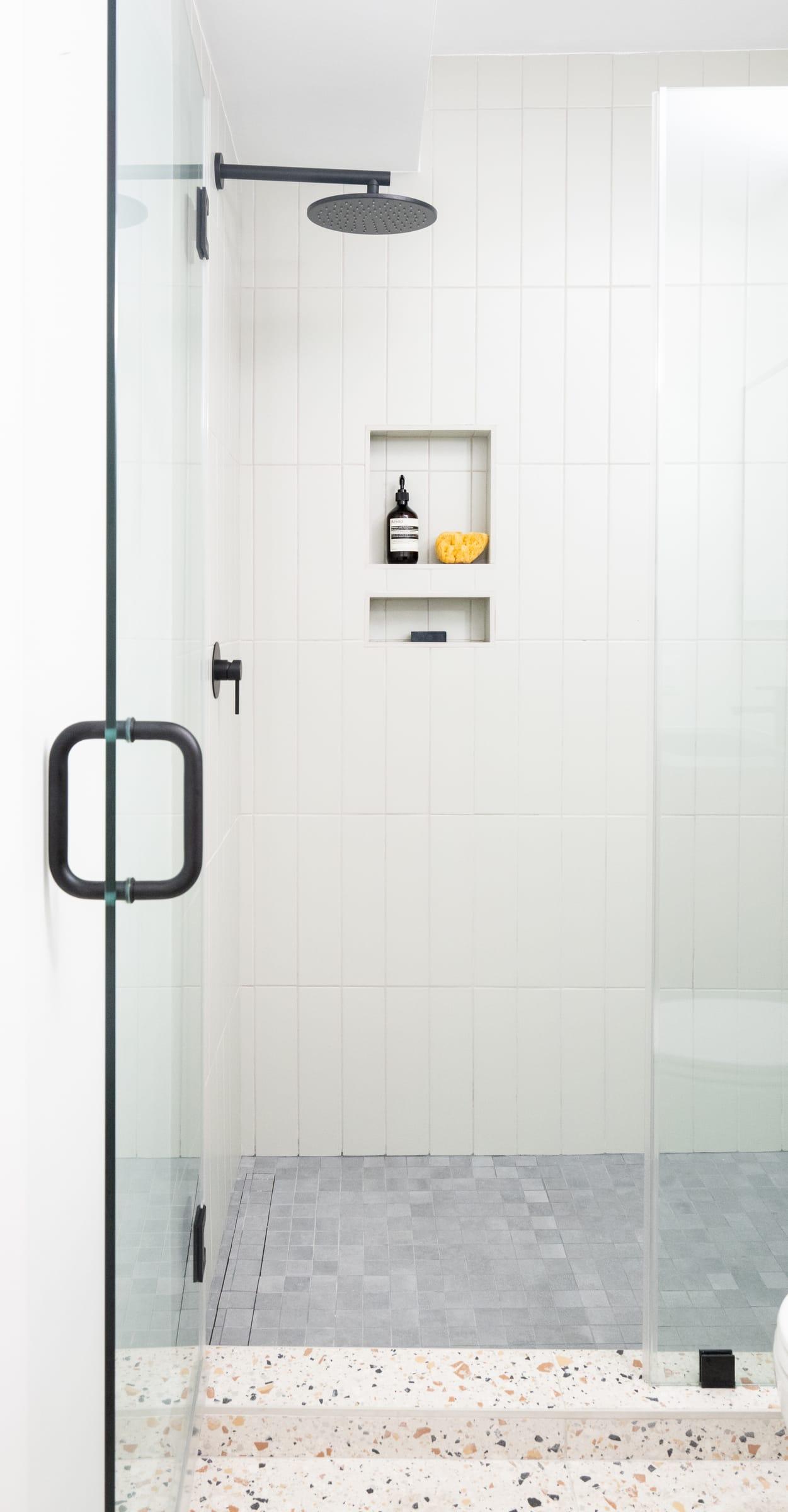 Glass shower with a terrazzo floor