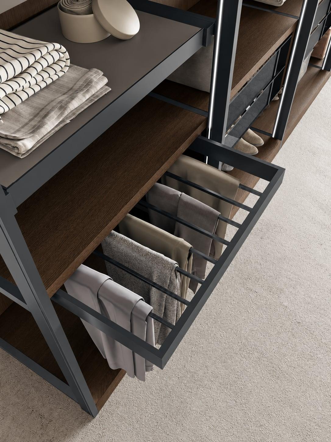 Wardrobe with a pull-out trouser rack under a shelf of folded linen