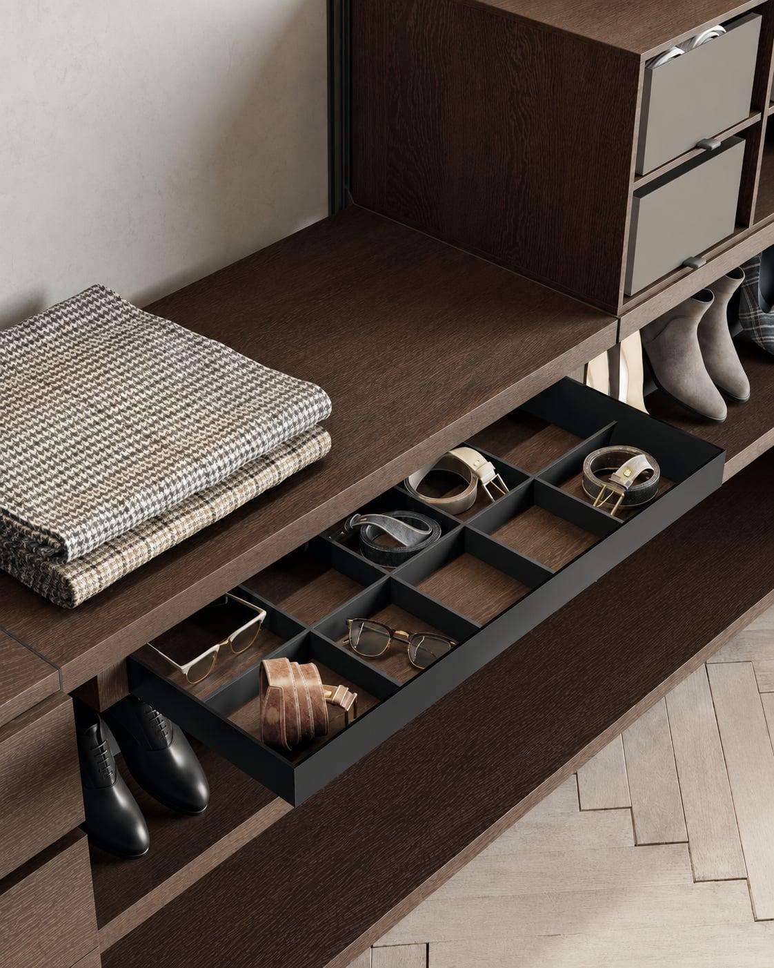 Walnut wardrobe drawer with a divided insert for accessories, folded jumpers beside it