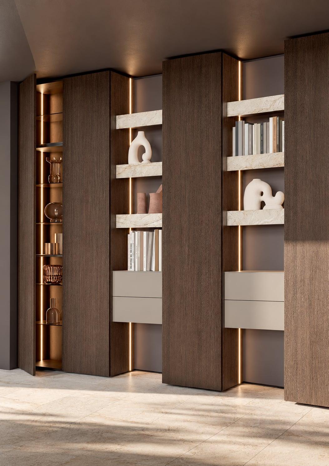 Tall walnut bookcase units with lit shelves and white ornaments