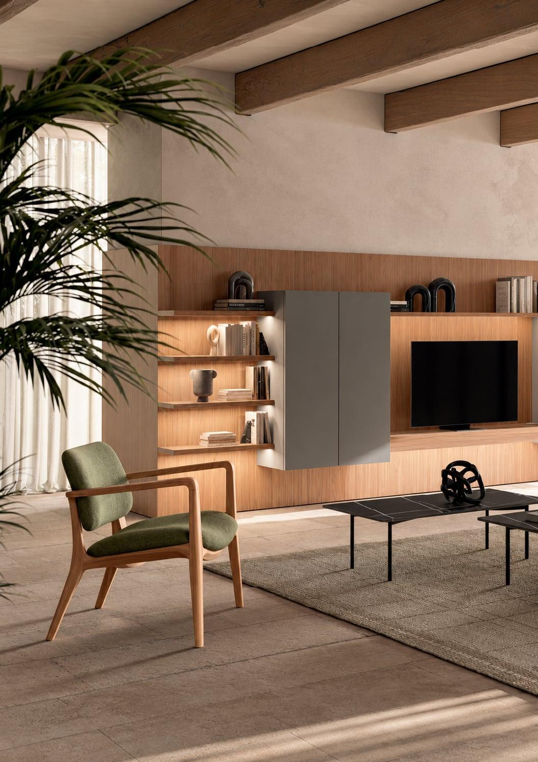 Living room wall unit with lit shelves around a television, a green armchair in front
